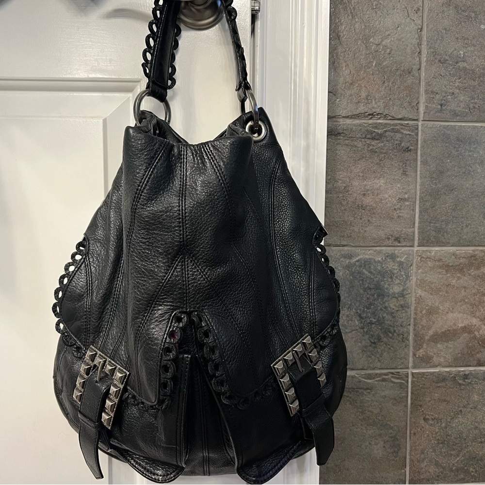 Betsey Johnson bag. Black leather. Inside zipper and pockets.